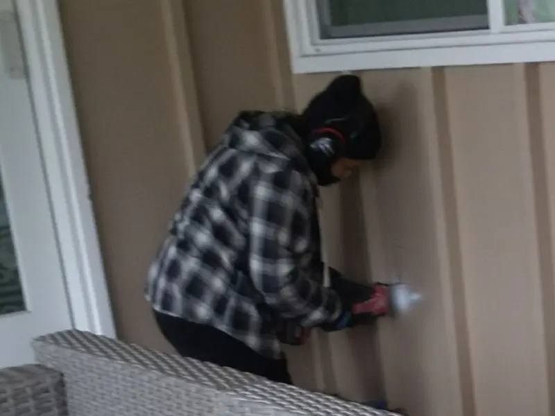 Professional electrician installing an exterior outlet in Carthage