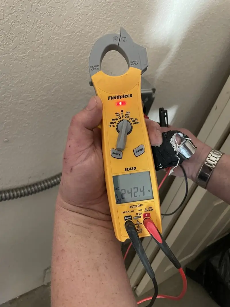 Voltage testing with clamp meter during Outlet Installation in Carthage